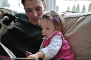 Baja reading a book with Carlton and Ainsley. This was just taken this week.